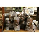 Five carved hard wood African male and female busts