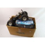 Two remote control cars with petrol engines together with a remote control car rolling chassis.