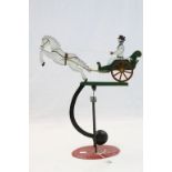 Folk Art style hand painted Metal Pendulum toy depicting a Man seated in Buggy