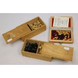 Three Wooden cased Chess sets to include a travel type