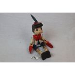 A jointed Pinocchio wooden figure