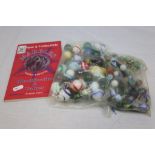 Two bags of vintage Glass Marbles & a Marble identification Book