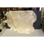 A large cow hide skin.