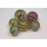 Six larger size handmade 19th century Glass Marbles, biggest approx 3.5cm diameter