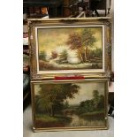 Two vintage oil paintings of landscape scenes in gilt frames.