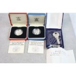 Two boxed Royal Mint Silver proof £1 Pound coins with COA's plus a cased Hallmarked Silver Key