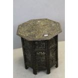 Indian Hardwood Octagonal Folding Table with profuse foliate carving throughout, 55cms wide x