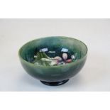 Small Moorcroft Pottery bowl in Spring Flower pattern, approx 10.5cm diameter