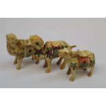 Three bone netsuke type figures of a money cow and 2 x camels/lamas