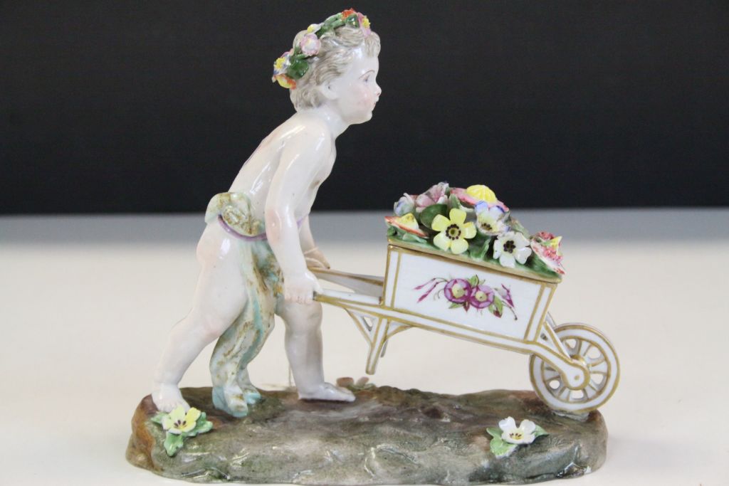 Meissen style ceramic figurine of a Garland Flower wearing Cherub pushing a wheelbarrow of Flowers - Image 3 of 7
