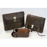 Vintage leather satchel with steel mounts, one other similar with brass mounts and a leather