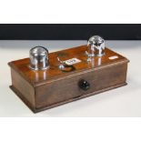 Wooden Ink stand with integral Drawer and two Chromed Inkwells plus inset 1946 Penny, measures