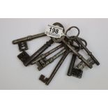 Eight large vintage Iron Door keys with complex fittings