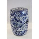 Oriental blue and white ceramic seat with stylised fish and floral decoration