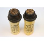 Two tall bone and wooden bottles decorated with Geisha girls and dragons carved to lid