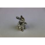 Silver figure of a seated rabbit