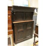 Antique Oak Court Cupboard with inverted finials and heavily carved throughout including a date of