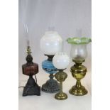 Three vintage Oil Lamps, one with painted blue Glass reservoir & white Glass shade, one with