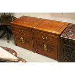 Pair of Chinese Hardwood Cabinets, each with single drawers above two panel doors with round