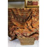 Vintage wicker basket containing two pairs of good quality curtains with geometric and floral