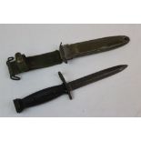 A United States / USA M7 Bayonet With A USM8A1 Scabbard. The M7 Bayonet Fits A M16 Rifle And Dates
