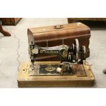A cased vintage Frister Rossman sewing machine.