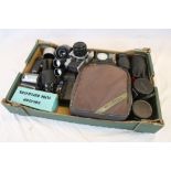 A cased Praktica MTL 3 camera and a quantity of lenses ,flashes etc.