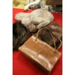 Three vintage fur hats and a snake or lizard handbag