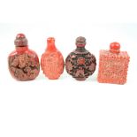 Four cinnabar lacquer snuff bottles