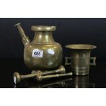 Oriental bronze/brass mortar with two similar pestles and a brass kendi.