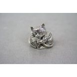 Cast silver figure of a cat and a ball of wool