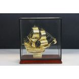 Glass cased Yellow metal model of the ship the "Golden Hind" with Wooden base, case approx 20 x 18.5