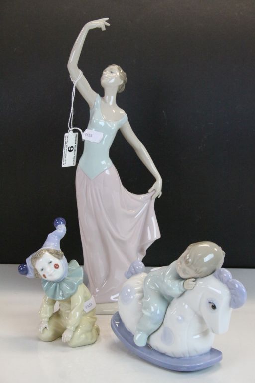 Three vintage Boxed Nao ceramic figurines to include a Child asleep on a Rocking Horse