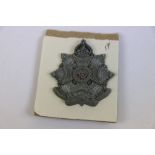 A World War Two / WW2 The Border Regiment Plastic Economy Badge With Two Metal Prong Fixings To