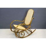 Wooden and wicker rocking chair in the style of Michael Thonet