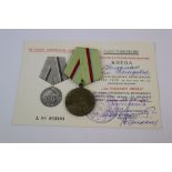 A Russian / Soviet World War Two / WW2 Defence Of Kiev Medal With Original Issue Document.