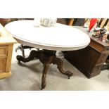 Victorian Walnut Oval Tilt Top Loo Table with Grey Painted Top and raised on a turned pedestal