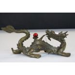 Chinese bronze dragon chasing flaming pearl