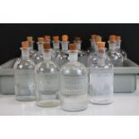 16 Glass Chemist Bottles with corks and Etched labels to include; Ammonium Hydroxide, Nitric Acid,