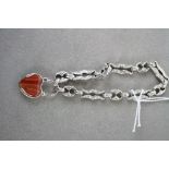 Silver link bracelet with heart shaped agate clasp