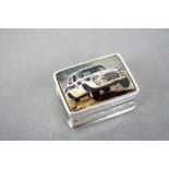 Silver pill box with enamel lid depicting a car