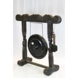 Heavily Carved Floor-standing Wooden Dinner Gong with Striker. 73cms high