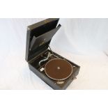 A vintage HMV wind up tabletop gramophone player together with a quantity of 78s