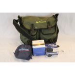 Wychwood fishing bag together with three fishing reels