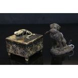 Cast iron gun dog figure with duck, together with a lidded resin trinket box with lizard decoration