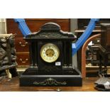 A large antique slate mantle clock with two train movement.