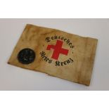 A World War Two German Third Reich Medics Armband Together With A 1939 May Badge, Both Items
