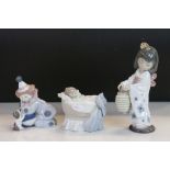 Three boxed Lladro ceramic Figurines to include Oriental Girl, Clown with Puppy & Baby in a Crib