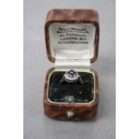 Ladies 18ct gold dress ring with four sapphire, set with central diamond flanked with diamonds in