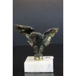 Bronze/brass car mascot in the form of an eagle mounted on a marble plinth